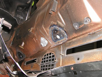 Bottom of cowl with welded inserts.